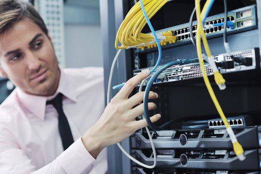 young handsome business man  engeneer in datacenter server room