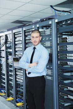 young handsome business man  engeneer in datacenter server room