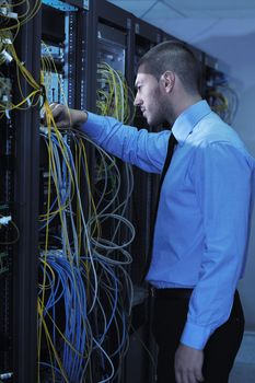 young handsome business man  engeneer in datacenter server room