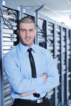 young handsome business man  engeneer in datacenter server room