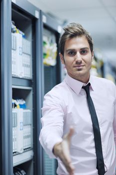 young handsome business man  engeneer in datacenter server room