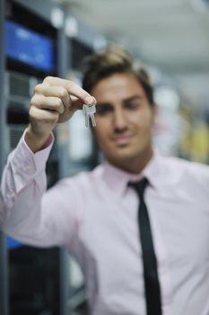 young handsome business man  engeneer in datacenter server room