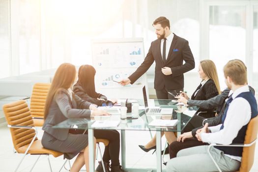 senior Manager of the company makes the presentation of a new financial project for the company's employees. the photo has a empty space for your text.