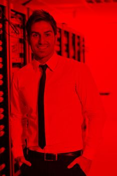 young handsome business man  engeneer in datacenter server room