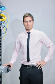 young handsome business man  engeneer in datacenter server room