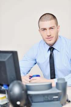 businessman with a headset portrait at bright call center helpdesk support office