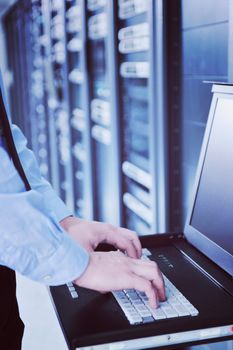 young handsome business man  engeneer in datacenter server room