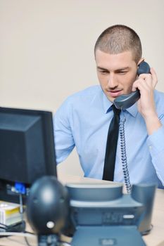 businessman with a headset portrait at bright call center helpdesk support office