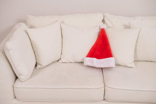 Santa claus hat on a white sofa