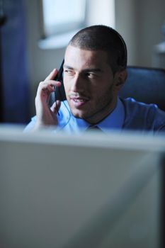 businessman with a headset portrait at bright call center helpdesk support office