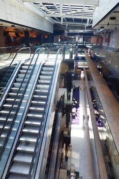 modern shopping mall store  interior escalator with lens flare