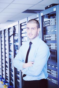 young handsome business man  engeneer in datacenter server room