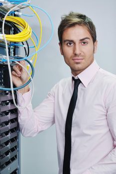 young handsome business man  engeneer in datacenter server room