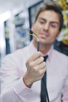 it business man in network server room have problems and looking for  disaster situation  solution