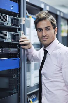 young handsome business man  engeneer in datacenter server room