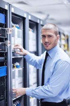 young handsome business man  engeneer in datacenter server room