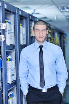 young handsome business man  engeneer in datacenter server room