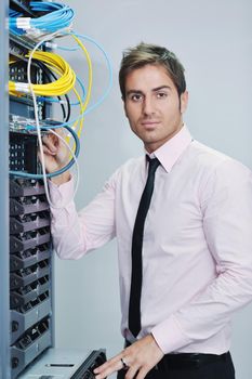 young handsome business man  engeneer in datacenter server room