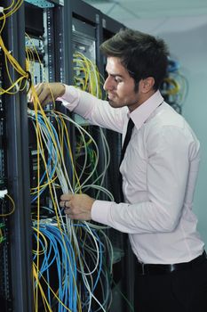 young handsome business man  engeneer in datacenter server room