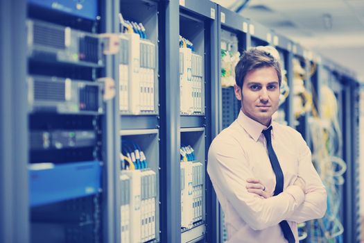 young handsome business man  engeneer in datacenter server room