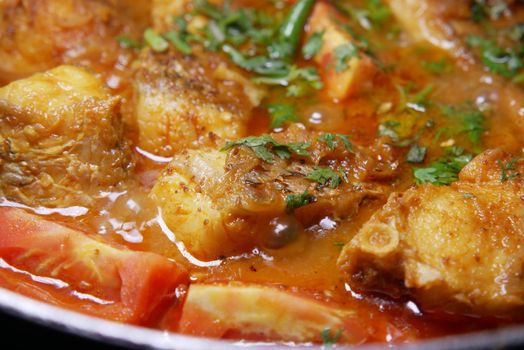 Close up of homemade indian curry fish.