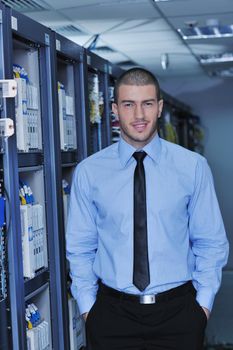 young handsome business man  engeneer in datacenter server room