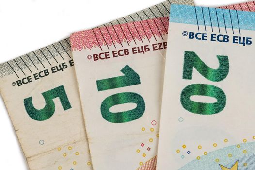 Close-up of five, ten and twenty euro bills