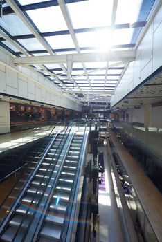 modern shopping mall store  interior escalator with lens flare