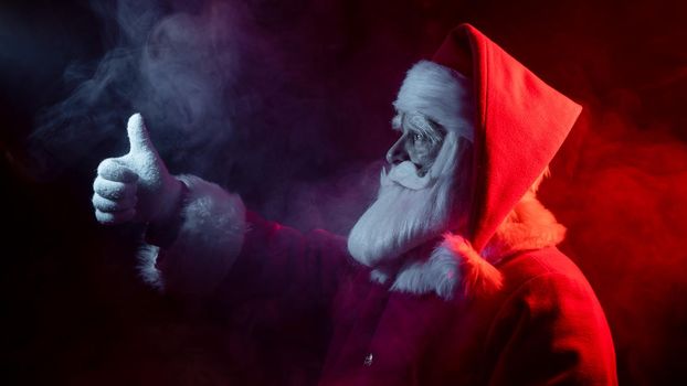 Santa claus in neon light on a black background. Christmas party