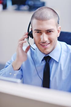 businessman with a headset portrait at bright call center helpdesk support office