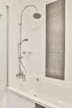 Beautiful bathroom with a big bathtub and white walls