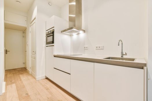 Luxurious kitchen area with wood parquet floor