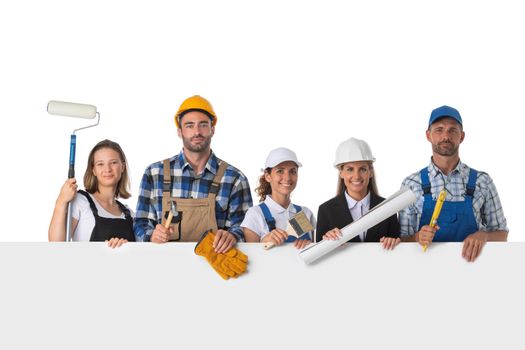 Group of industrial workers with blank banner isolated over white background