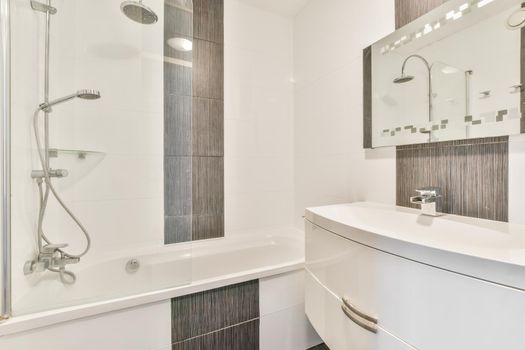 Beautiful bathroom with a big bathtub and white walls