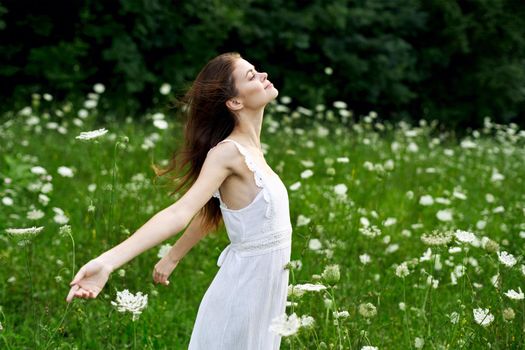 cheerful woman outdoors flowers freedom summer. High quality photo