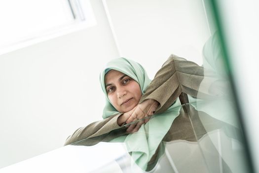 Low angle of a Muslim Arabic woman indoors