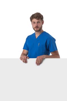 Portrait of a handsome caucasian male doctor nurse with blank banner isolated on white background