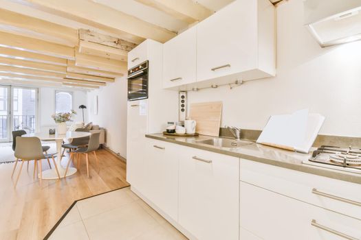 Chic kitchen with white kitchen units and oven