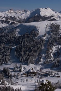 winter sunrise with fresh snow in alps mountains on fresh morning