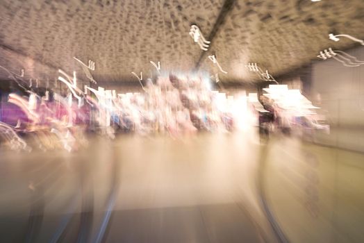 Shopping mall center escalators. Zoom blur movement.