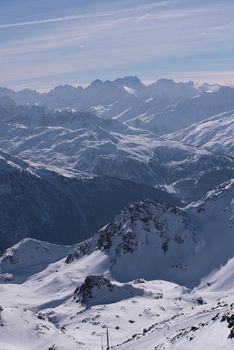 mountain landscape at winter with fresh snow on beautiful sunny day at french alps