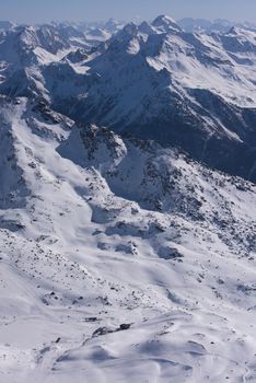 mountain landscape at winter with fresh snow on beautiful sunny day at french alps