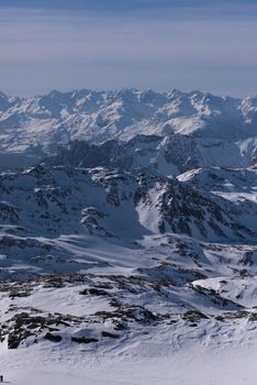 mountain landscape at winter with fresh snow on beautiful sunny day at french alps