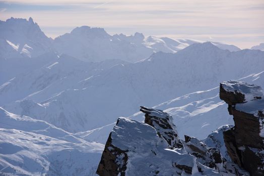 mountain landscape at winter with fresh snow on beautiful sunny day at french alps