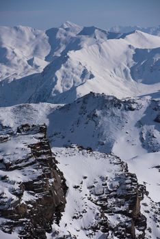 mountain landscape at winter with fresh snow on beautiful sunny day at french alps