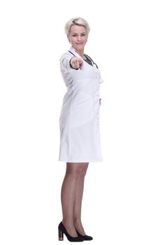 in full growth. young woman doctor looking at you . isolated on a white background.