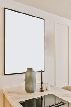 Stunning kitchen decor in the form of a vase next to candles and a painting in the background