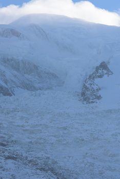 French alps mountain peaks covered with fresh snow. Winter landscape nature scene on beautiful sunny winter day.