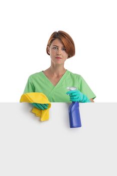 A woman cleaning lady with a rag in her hand holds detergent spray. House cleaning concept or office cleaning concept. Blank banner