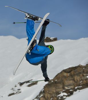 jumping skier at mountain winter snow fresh suny day